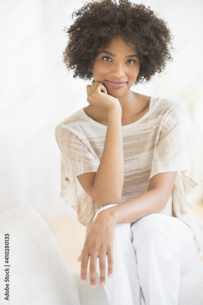 Portrait of woman sitting on sofa Portrait of woman sitting on sofa