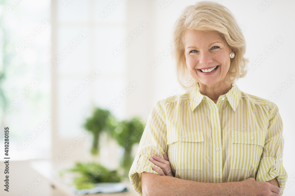 Portrait of mature woman in kitchen