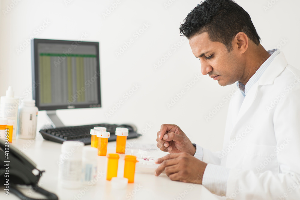 Pharmacist preparing prescription medicine Pharmacist preparing prescription medicine