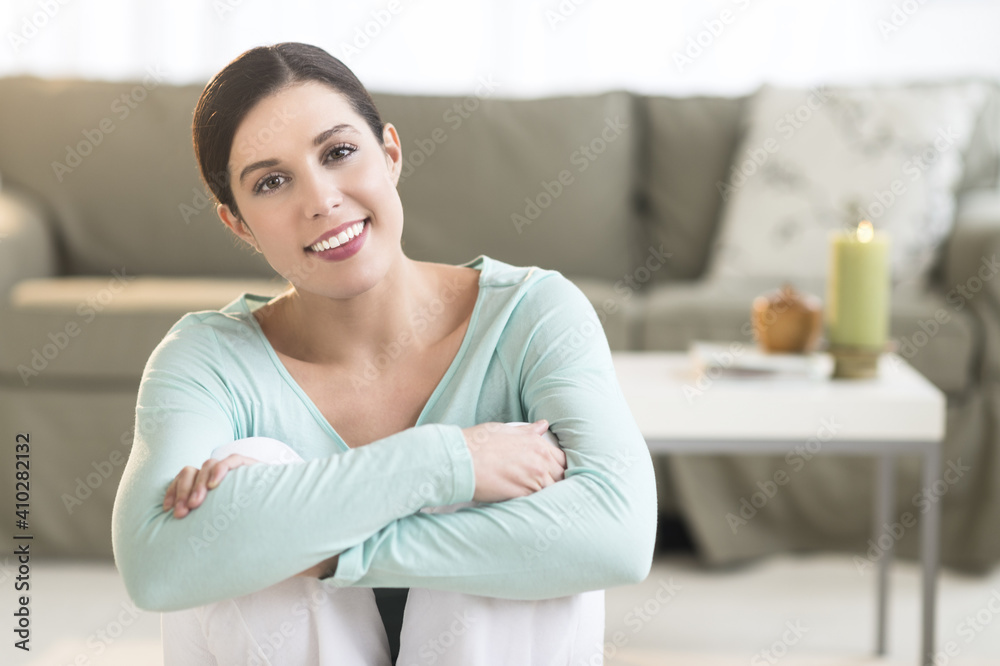 Woman sitting in living room Woman sitting in living room
