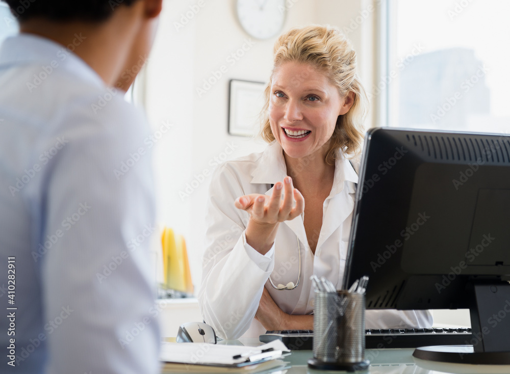 Patient during consultation with female doctor Patient during consultation with female doctor