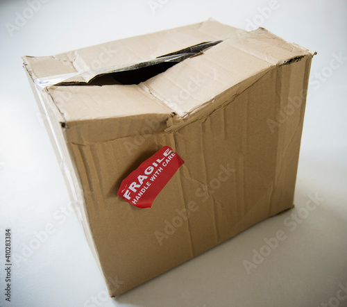 Studio Shot of damaged box with fragile label