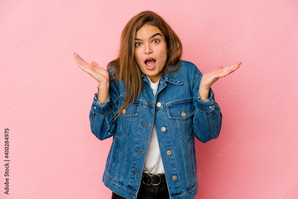 Young skinny caucasian teenager girl surprised and shocked. Young skinny caucasian teenager girl surprised and shocked.