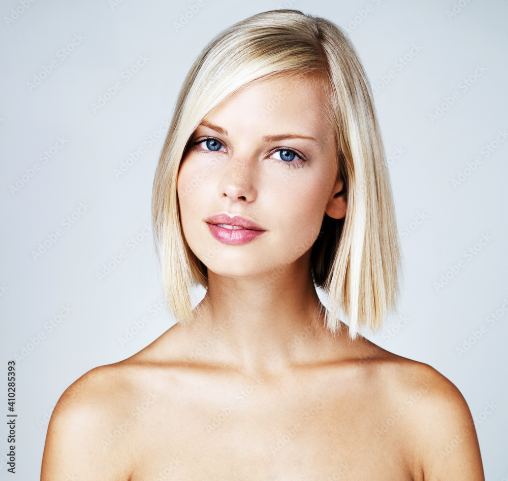 Portrait of young woman on light blue background Portrait of young woman on light blue background