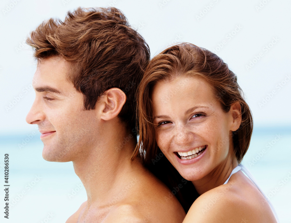 Young attractive couple enjoying summer holiday on beach Young attractive couple enjoying summer holiday on beach