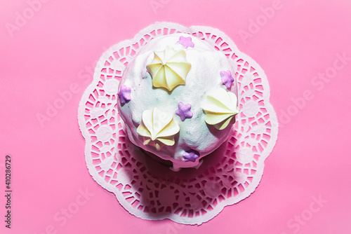 Easter cake, Kulich sweet pastry for easter celebration. Baking for the easter table on a pink backdrop isolated, decorations for the holidays