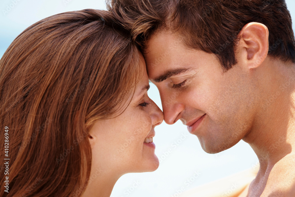 Young attractive couple enjoying summer holiday on beach Young attractive couple enjoying summer holiday on beach