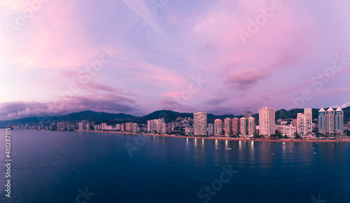 Beautiful sunset, aerial view of the beach, acapulco city seen from above. Travel and vacation concept. Colorful sunset on the beach photo