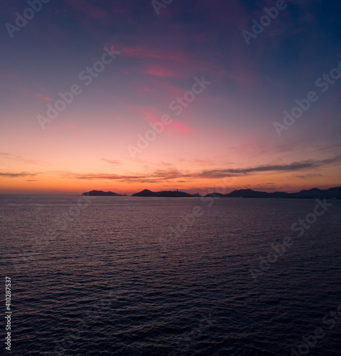 Beautiful sunset, aerial view of the beach, acapulco city seen from above. Travel and vacation concept. Colorful sunset on the beach