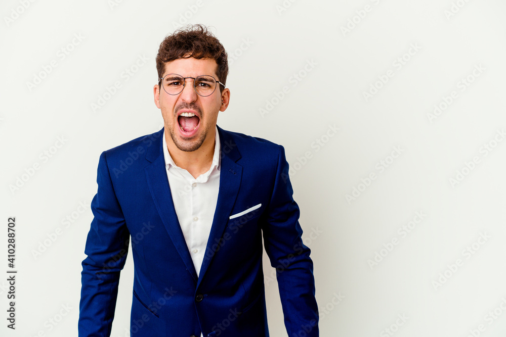 Young business caucasian man isolated on white background shouting very angry, rage concept, frustrated. Young business caucasian man isolated on white background shouting very angry, rage concept, frustrated.