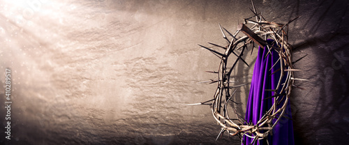 
Crown Of Thorns And Purple Robe Hanging On Nail In Stone Wall With Light Rays
 - Crucifixion Of Jesus Christ