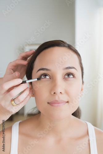 Woman having make-up applied