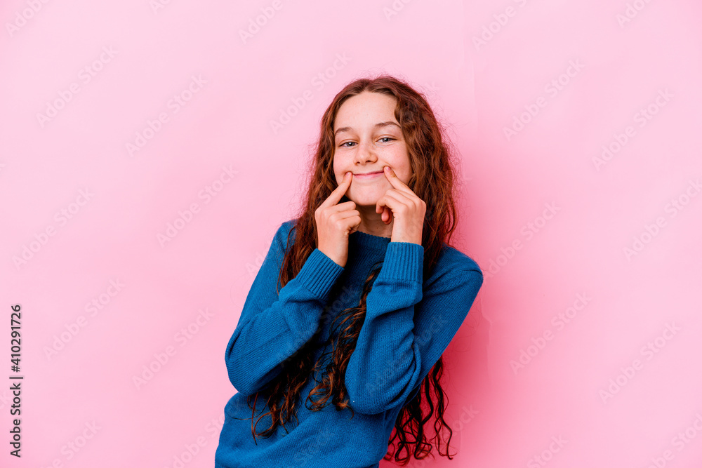 Little caucasian girl isolated on pink background doubting between two options. Little caucasian girl isolated on pink background doubting between two options.