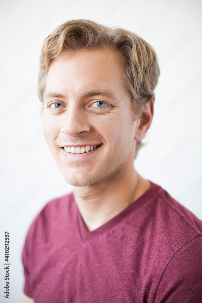 Studio Shot of young adult man expressing happiness Studio Shot of young adult man expressing happiness