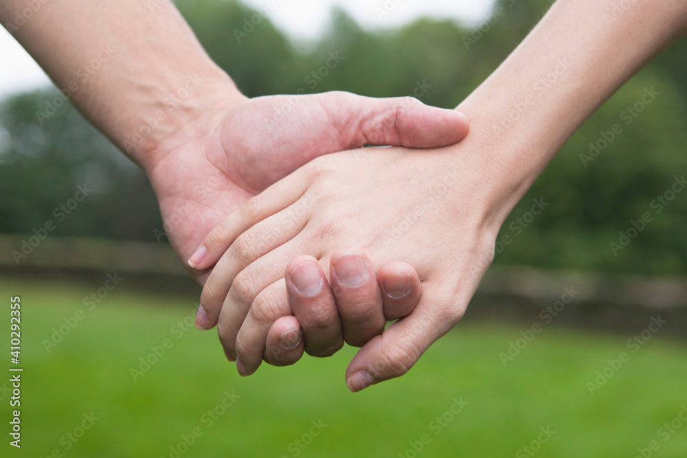 Close-up of couple holding hands Close-up of couple holding hands