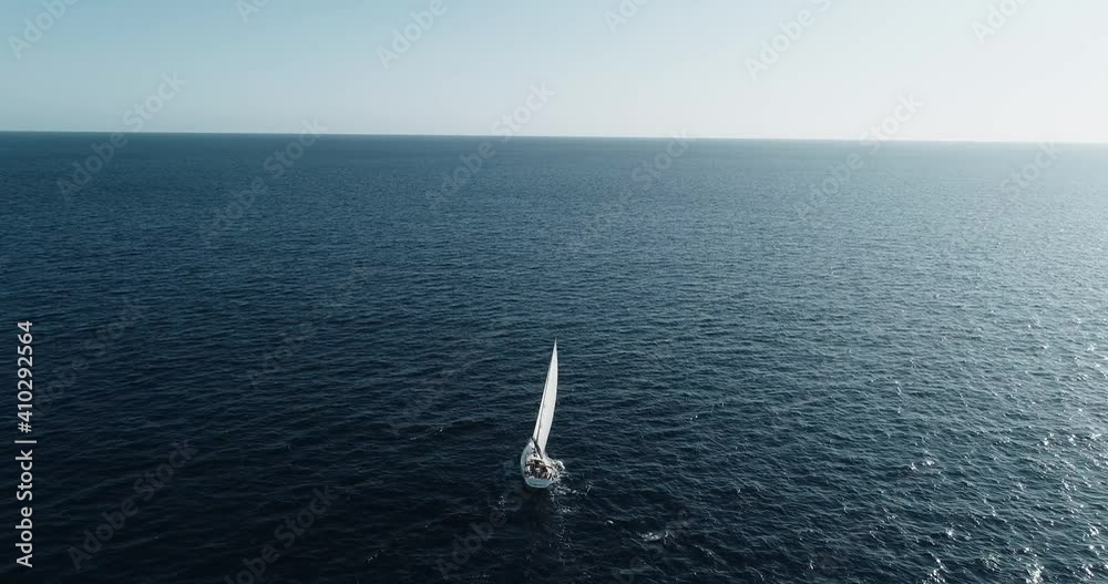 Panoramic view of a sailboat sailing in the middle of the Mediterranean Sea under the blue sky. Perfect for leisure activity in travel and holidays 4K Panoramic view of a sailboat sailing in the middle of the Mediterranean Sea under the blue sky. Perfect for leisure activity in travel and holidays 4K