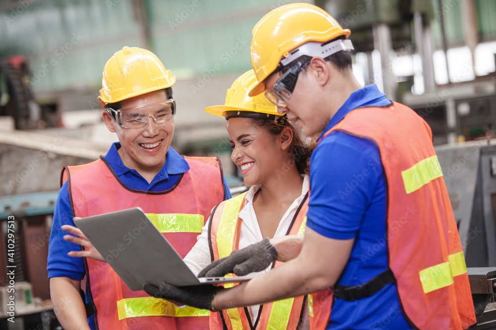 Male and Female Industrial Engineers Talk with Factory Worker while Using Laptop. industrial man engineer with laptop in a factory, Male and Female Industrial Engineers Talk with Factory Worker while Using Laptop. industrial man engineer with laptop in a factory,