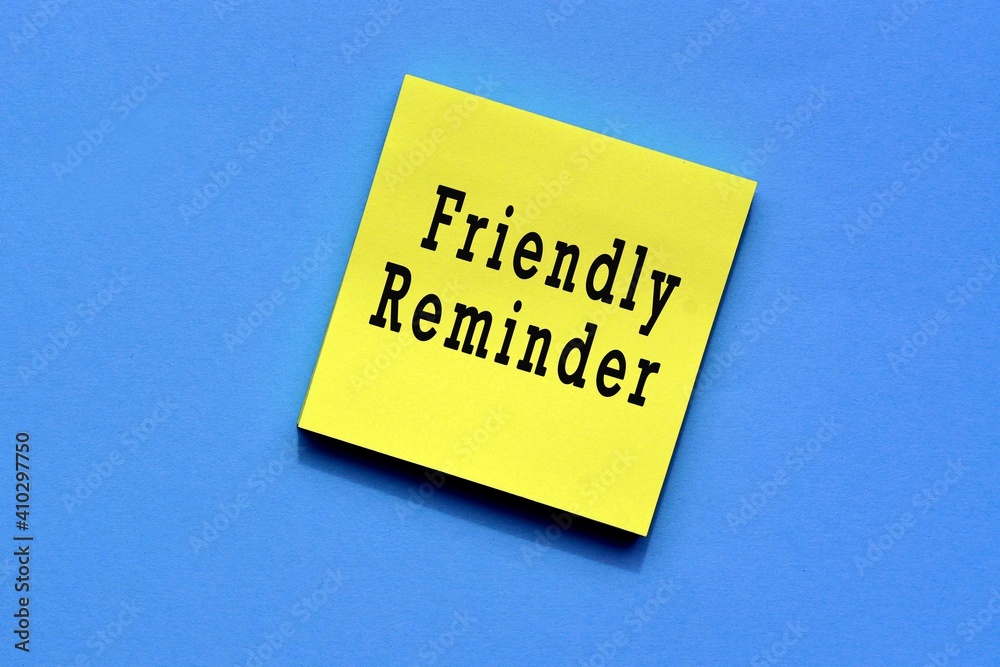 Friendly reminder text on yellow sticky note