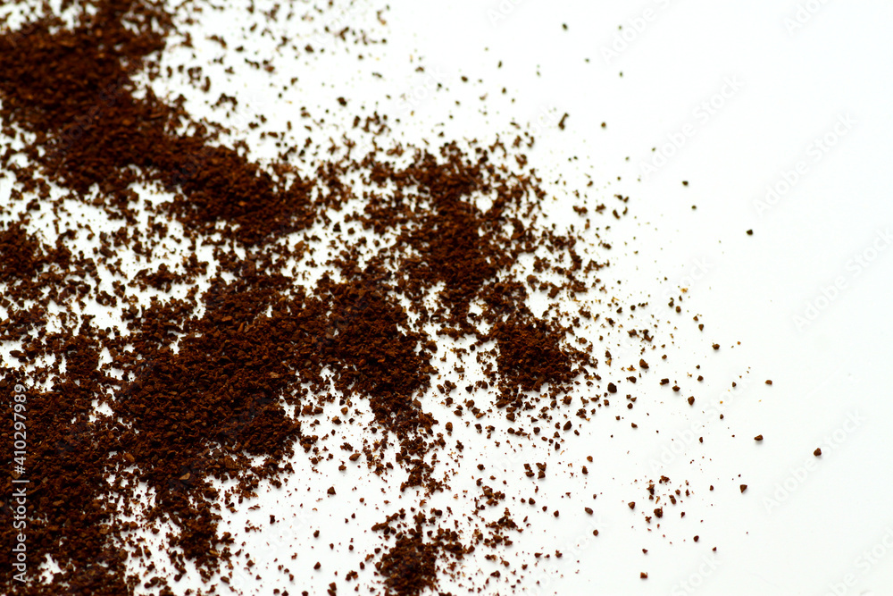 Ground coffee beans against white background Ground coffee beans against white background