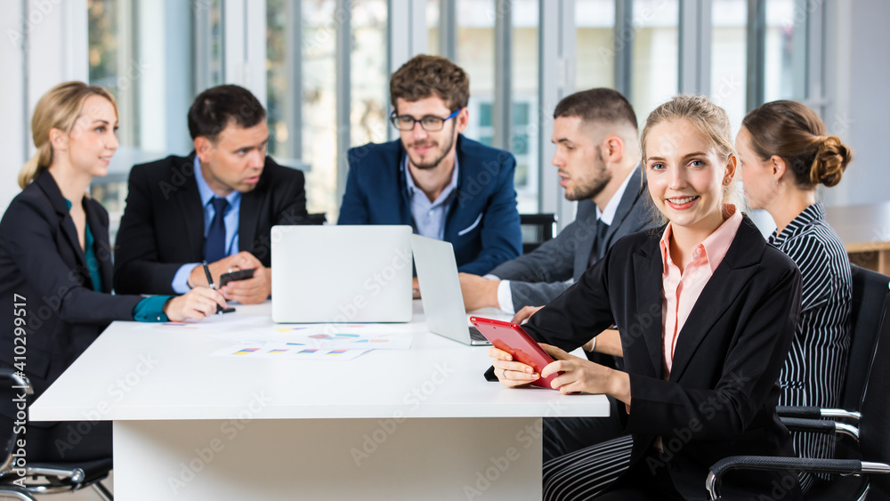Group portrait of six business people team sitting and talking in conference together in an office and while the woman boss sit on the top of table. Idea for success of teamwork in modern business Group portrait of six business people team sitting and talking in conference together in an office and while the woman boss sit on the top of table. Idea for success of teamwork in modern business