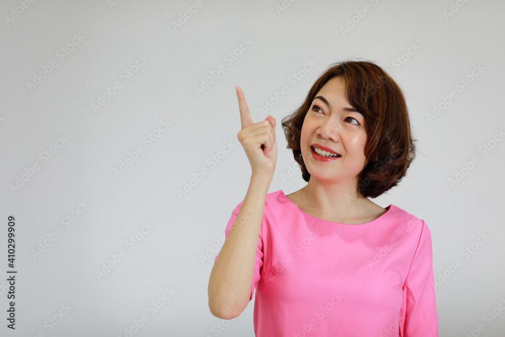 Portrait of a young and beautiful Asian woman with self-confident pose on white background
