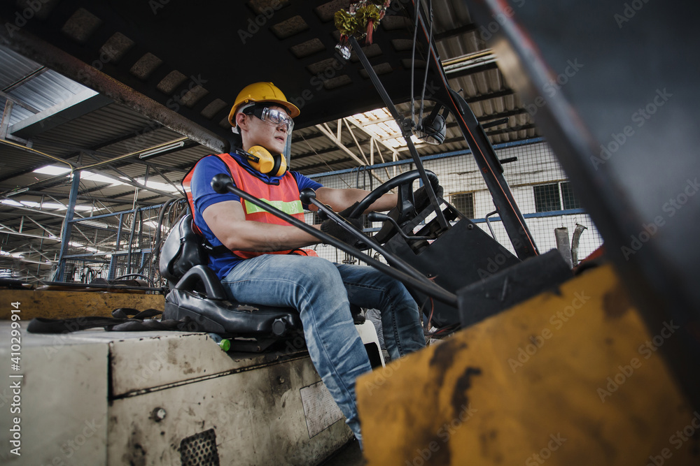 worker forklift driver working in industrial factory or warehouse. worker Asia