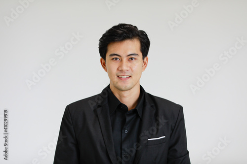 Portrait of young and handsome good looking Asian man on white background.