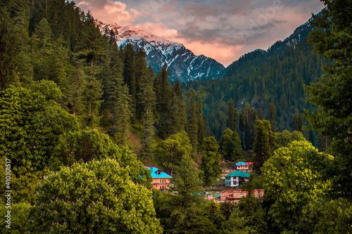 Scenic view in the Himalayan range. Sunrise view from the dense forest of Himalayan village Grahan, Kasol, Himachal Pradesh, India.