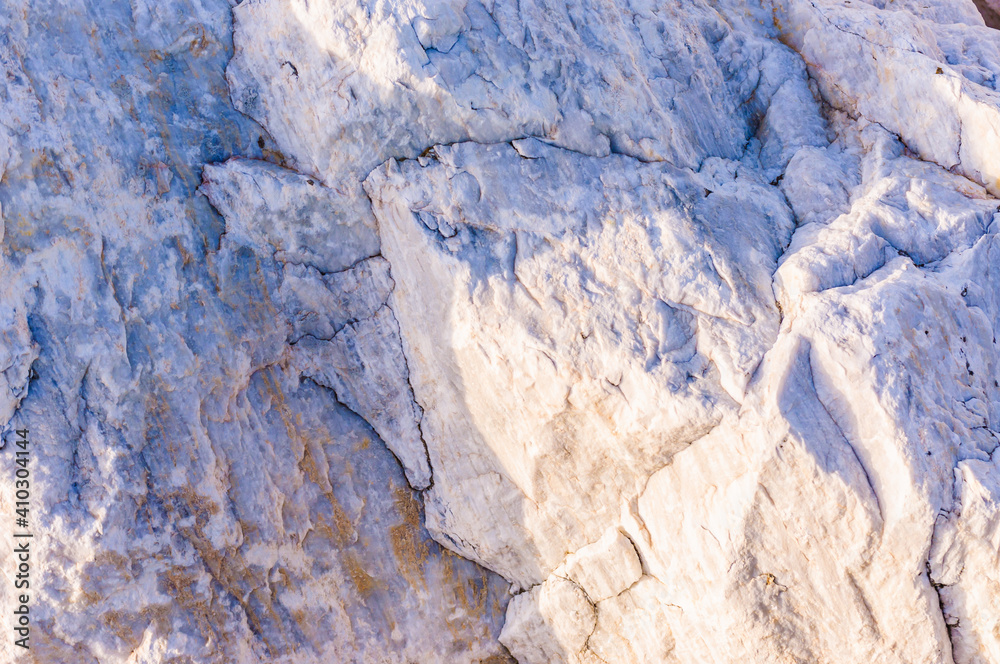 close up detail of rock surface with variety of colors under natural sunlight close up detail of rock surface with variety of colors under natural sunlight