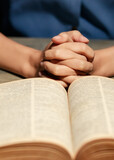 Close up hand. Christian Asian man join hands in praying for Jesus' blessings to show love and confession of their sins according to the Christian faith. Concept reading prayer..