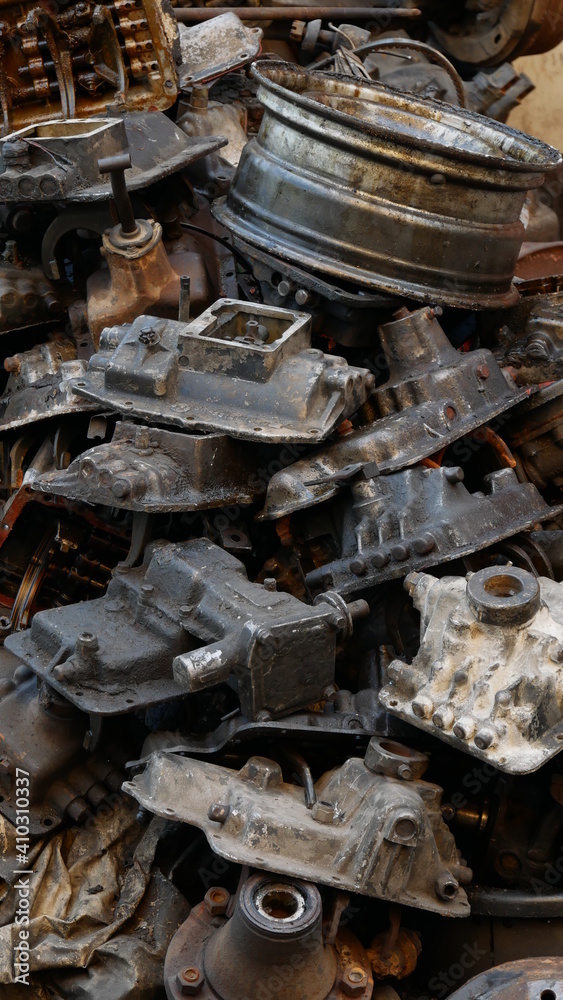 Pile of old machine parts in second hand machinery shop, background of damage and rusty old car machine Pile of old machine parts in second hand machinery shop, background of damage and rusty old car machine
