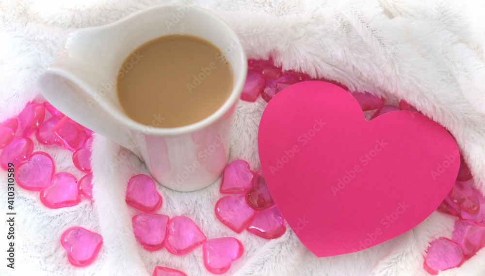 Greeting card  in shape heart with place for text. blurred cozy  still life with cup of coffee and plaid. Details of cozy bedroom,  morning for a loved one