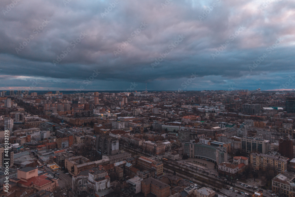 A bird's eye view of the dark blue sky over the city. Gloomy city