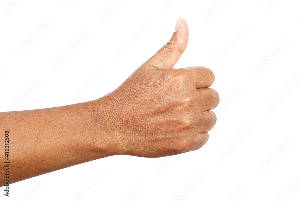 Female hand showing thumbs up sign against isolated on white background with clipping path Female hand showing thumbs up sign against isolated on white background with clipping path