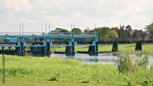 Sanxing Township, Yilan County, Taiwan - January 16, 2021: View of Annong river flood diversion weir watergate. photo