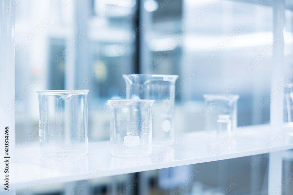 Breaker and glassware in Chemical laboratory. Analysis of Science, biological medical, research and development concepts Breaker and glassware in Chemical laboratory. Analysis of Science, biological medical, research and development concepts
