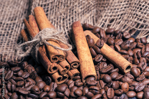 Coffee beans and cinnamon sticks photo