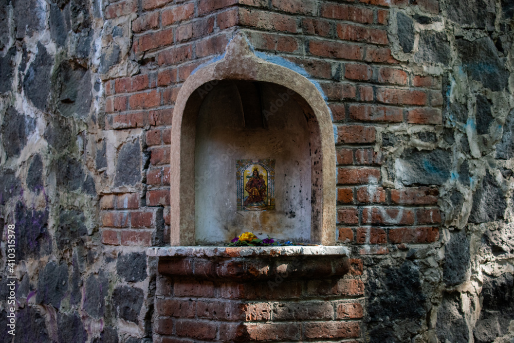 Small altar on the corner of a stone wall Small altar on the corner of a stone wall