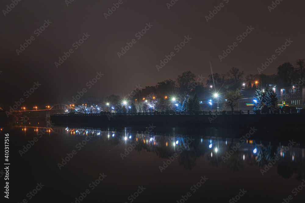 Beautiful panorama of the night city with water.