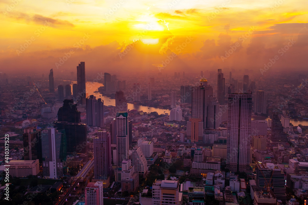 Cityscape sunset aerial view from top building, Aerial view of Bangkok city in Thailand
