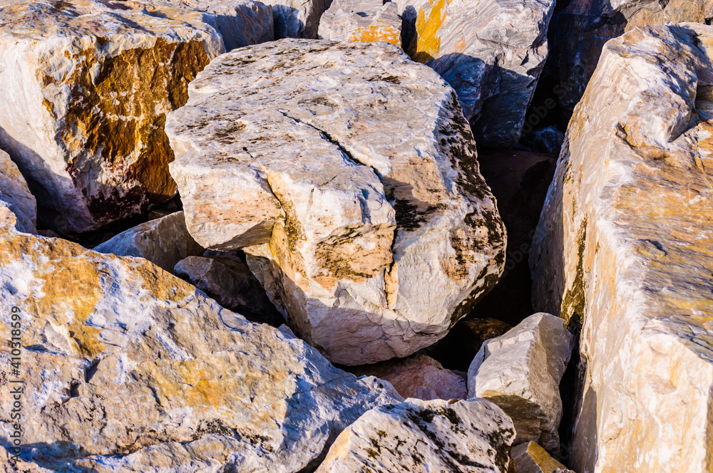 close up detail of rock surface with variety of colors under natural sunlight close up detail of rock surface with variety of colors under natural sunlight