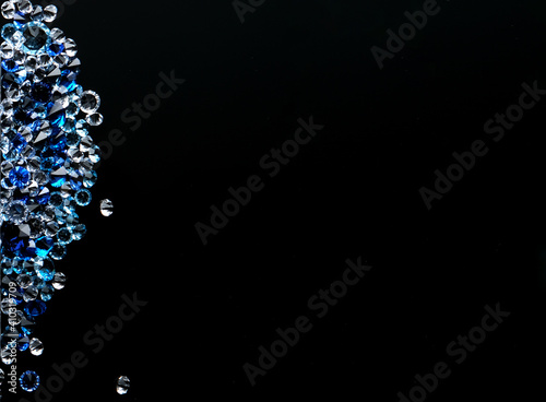 white and blue crystals on a black background