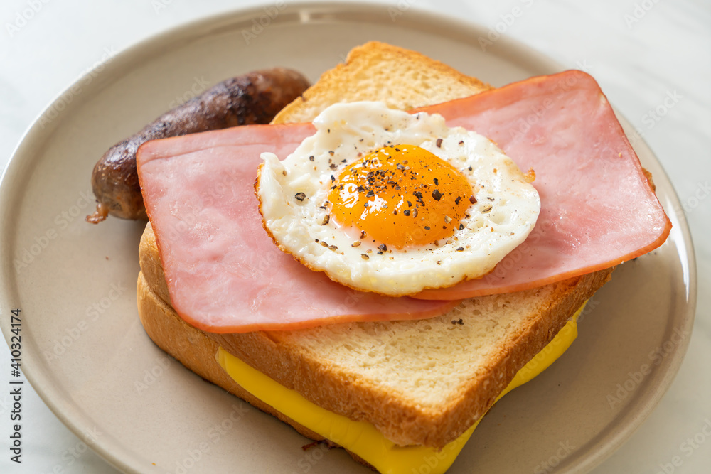 bread toasted cheese topped ham and fried egg with pork sausage bread toasted cheese topped ham and fried egg with pork sausage