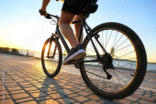 Male cyclist riding bicycle...