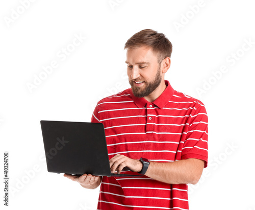 Young man with laptop on wh...