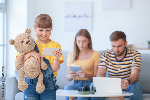 Family with modern devices ...