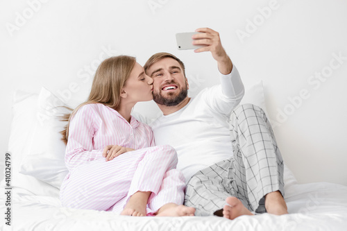 Young couple taking selfie ...