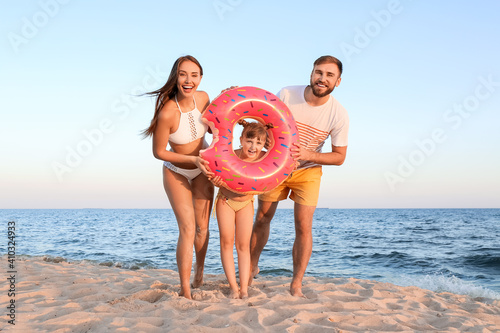 Happy family with inflatabl...