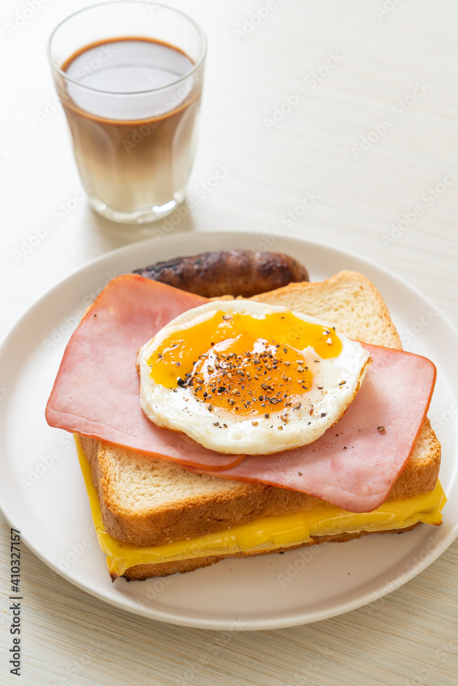 bread toasted cheese topped ham and fried egg with pork sausage bread toasted cheese topped ham and fried egg with pork sausage