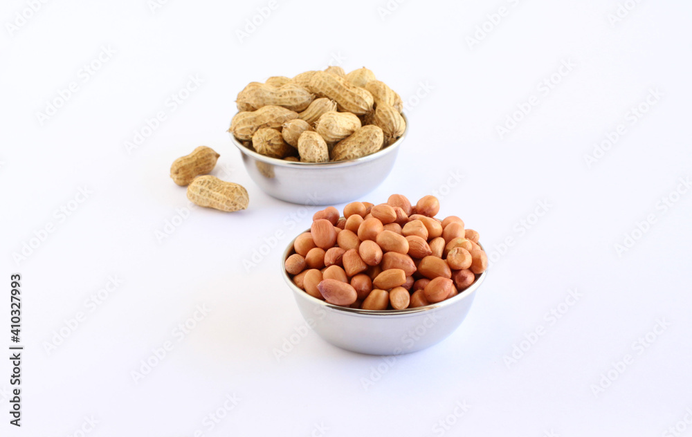 Healthy food peanuts and peanut pods in steel bowls. Healthy food peanuts and peanut pods in steel bowls.